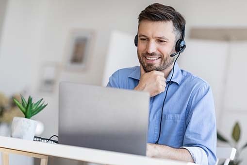 Hotline Support Service. Male call center operator in headset wo Hotline Support Service. Male call center operator in headset wo